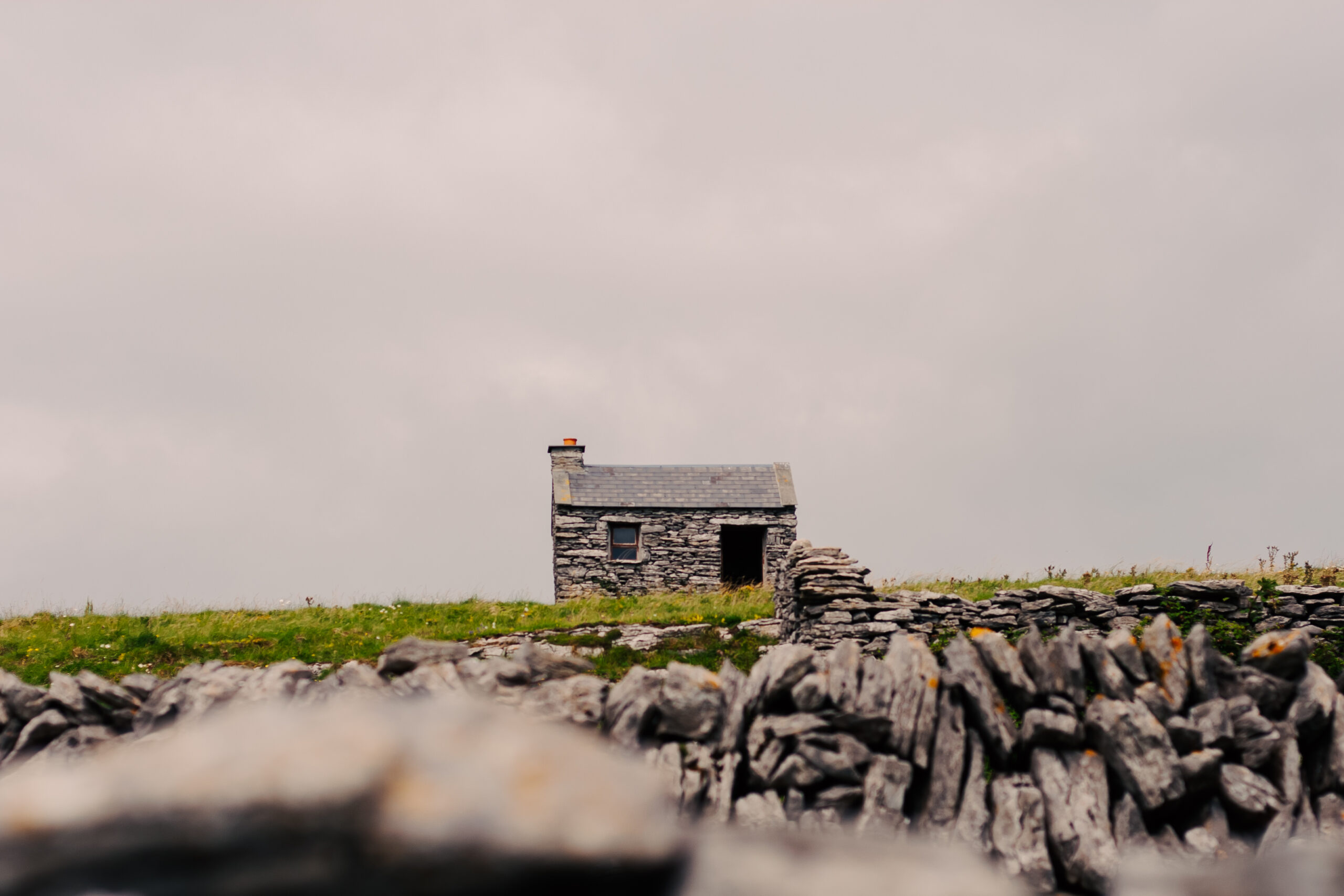 Stone cottage and dry stone wall on the Aran Islands, Ireland